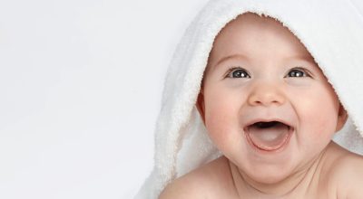 Cute-Smiling-Baby-Under-The-Towel