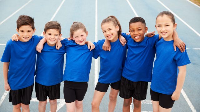 Portrait Of Children In Athletics Team On Track On Sports Day